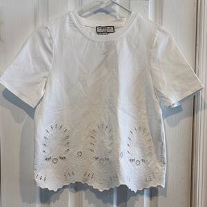 Bagatelle white Short Sleeved Top with cut out design. Size XS. NWT.